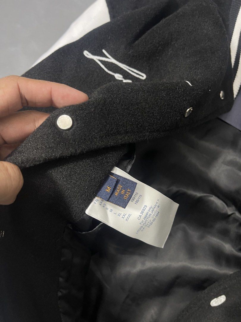 Louis Vuitton Monogram Pearl Varsity Bomber Jacket (Category: Coats, Jackets and Outerwear) located in Manila. Submitted by mine2ownit (Listing ID 1468793793, Image 3). Description: - Size: M - Material: Premium black wool body with genuine white leather sleeves - Design: Large beaded LV chest logo with script signature embroidery and bold marquee typography on the back - Details: Snap button closure, classic striped ribbed collar, cuffs, and hem