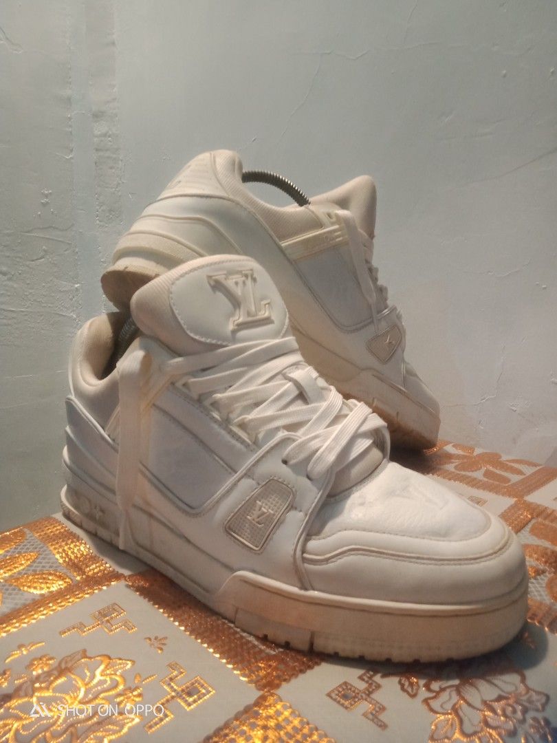 Louis Vuitton Trainer White (Category: Sneakers) located in Manila. Submitted by whoss.nielidk (Listing ID 1468716945, Image 1). Description: - Brand: Louis Vuitton - Style: Classic chunky skate silhouette sneakers - Material: Premium white leather with embossed monogram on toe and side panels - Details: Padded collar and crisp white laces - Sole: Thick, durable rubber sole - Vibe: Perfect high-end streetwear option.