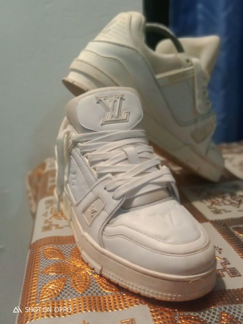 Louis Vuitton Trainer White (Category: Sneakers) located in Manila. Submitted by whoss.nielidk (Listing ID 1468716945, Image 2). Description: - Brand: Louis Vuitton - Style: Classic chunky skate silhouette sneakers - Material: Premium white leather with embossed monogram on toe and side panels - Details: Padded collar and crisp white laces - Sole: Thick, durable rubber sole - Vibe: Perfect high-end streetwear option.