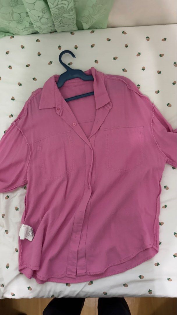 Love Bonito Pink Button Down Shirt Size M (Category: Shirts) located in Makati City. Submitted by kaassy (Listing ID 1468751935, Image 3). Description: - Brand: Love Bonito - Style: Button-down shirt with relaxed fit - Size: M (UK 10, US 6) - Color: Pink with matching pink buttons - Details: Dual chest pockets, collar neck, and trendy raw frayed edge details on shoulders and sleeves - Condition: Excellent pre-loved condition - Mode of Payment: GC