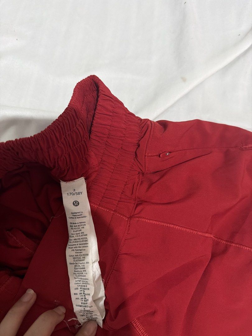 Lululemon Athletic Shorts Size 2 Red (Category: Shorts) located in Pasay City. Submitted by gold1001 (Listing ID 1468808311, Image 2). Description: - Brand: Lululemon - Color: Vibrant Red - Size: 2 - Material: Lightweight, breathable fabric ideal for runs and workouts - Features: Elastic waistband with drawstring loop and built-in liner - Details: Clean inner tag and clear logo on the leg hem - Condition: Excellent, ready to wear.