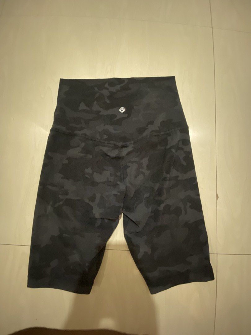 Lululemon Camo High Rise Biker Shorts (Category: Shorts) located in Vinzons. Submitted by gabrielvic (Listing ID 1468737986, Image 1). Description: - Brand: Lululemon - Style: High-waisted biker shorts - Color/Pattern: Dark grey camo - Features: Classic logo on back waistband, super stretchy fabric - Fit: Short length, hits right above the knee - Condition: Like new, clean with no signs of wear - Ideal for: Gym workouts, running errands, or casua
