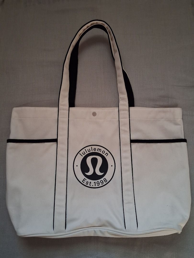 Lululemon Daily Multi-Pocket tote bag (Category: Tote Bags) located in Quezon City. Submitted by threeleggeddog (Listing ID 1468838623, Image 1). Description: pre-loved 9/10 condition white color.