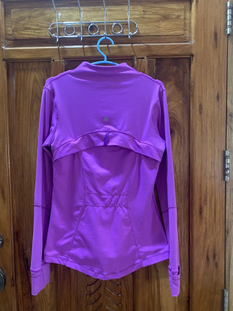 Lululemon Define Jacket Purple (Category: Coats, Jackets and Outerwear) located in Vinzons. Submitted by gabrielvic (Listing ID 1468740442, Image 2). Description: - Brand: Lululemon - Color: Bright purple - Fit: Fitted cut through the body with a stand collar - Closure & Pockets: Zip-up front with signature logo zipper pull and zipped front pockets - Comfort & Performance: Smooth performance fabric with long sleeves and thumbholes at cuffs - Extr
