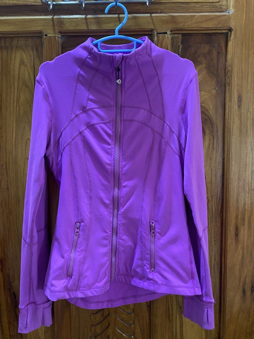 Lululemon Define Jacket Purple (Category: Coats, Jackets and Outerwear) located in Vinzons. Submitted by gabrielvic (Listing ID 1468740442, Image 1). Description: - Brand: Lululemon - Color: Bright purple - Fit: Fitted cut through the body with a stand collar - Closure & Pockets: Zip-up front with signature logo zipper pull and zipped front pockets - Comfort & Performance: Smooth performance fabric with long sleeves and thumbholes at cuffs - Extr