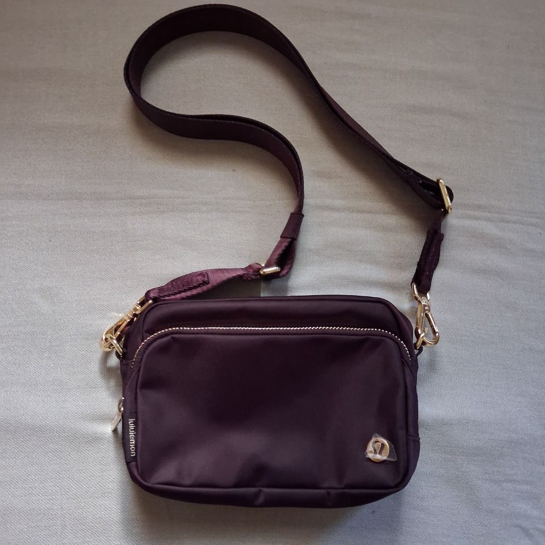 Lululemon Everywhere crossbody (Category: Cross-body Bags) located in Quezon City. Submitted by threeleggeddog (Listing ID 1468841707, Image 1). Description: brand new with detached tags black/plum/gold color.