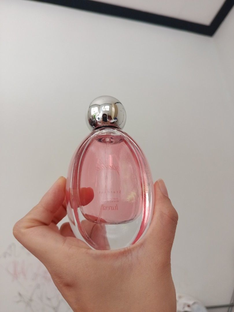 Lured Opalite Stardust Parfum Elixir 45ml (Category: Fragrance & Deodorants) located in Quezon City. Submitted by cblakes (Listing ID 1468721480, Image 2). Description: - Brand/Model: Lured Stardust Parfum Elixir in Opalite - Volume: 45 ml / 1.5 fluid ounces - Packaging: Glass bottle with pink liquid and a sleek round silver cap - Design: Label printed directly on the front glass - Condition: Brand new and 100% authentic - Shipping: Fast shipping