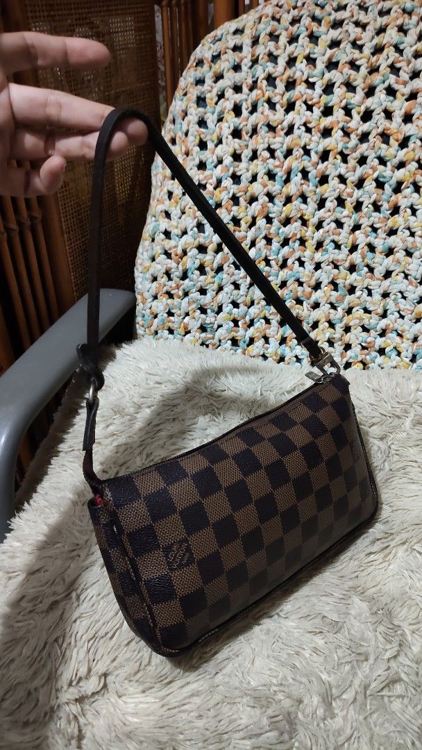 LV...damier (Category: Shoulder Bags) located in Cebu City. Submitted by lumaynojes00490 (Listing ID 1468809204, Image 3). Description: - Iconic brown and dark brown checkered canvas exterior - Secure top zipper closure - Vibrant red fabric interior lining with a convenient slip pocket - Chic gold-tone hardware on the strap attachments - Compact size, perfect for daily essentials or evening outings - Comfortable leather shoulder strap.