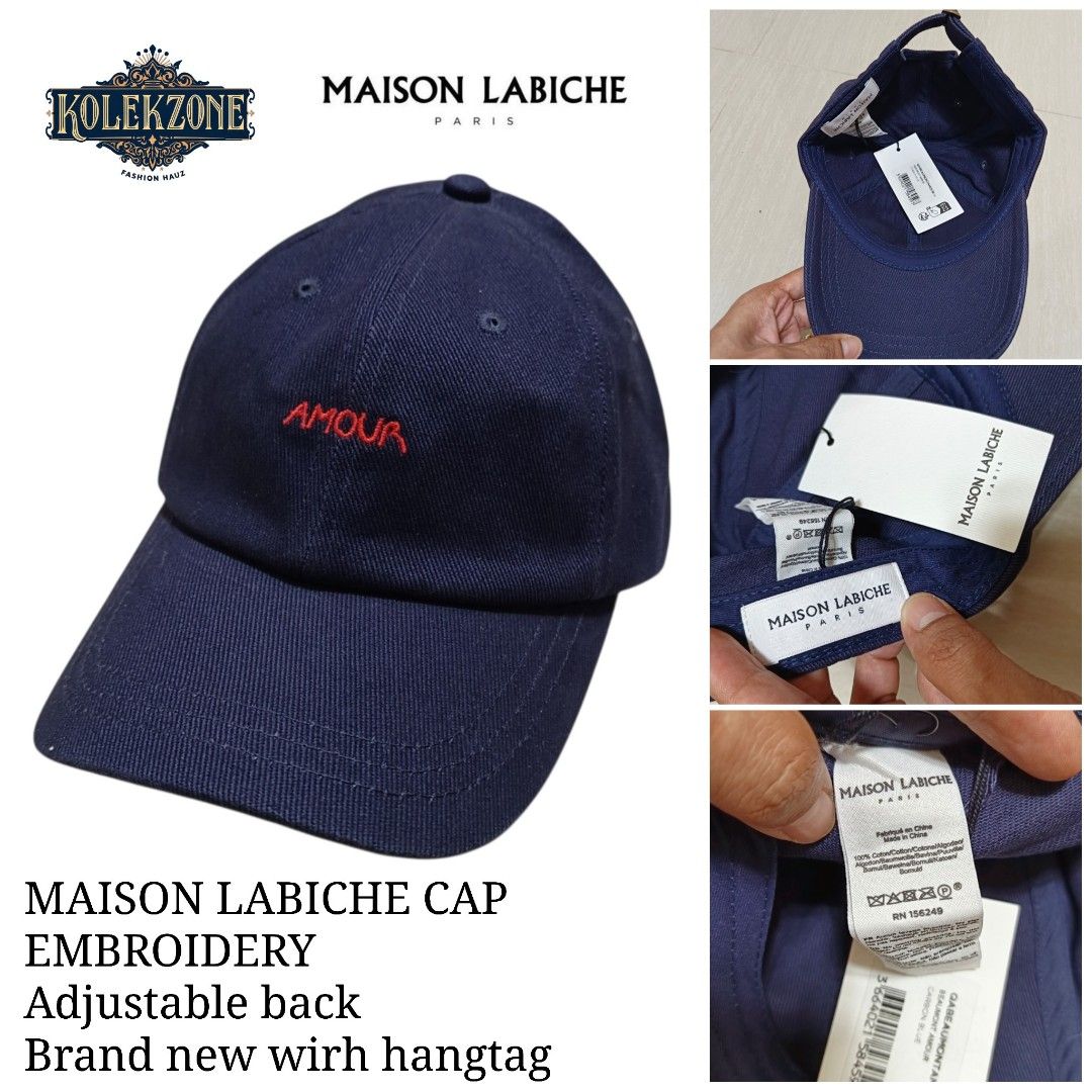 Maison Labiche Beaumont Amour Cap Carbon Blue (Category: Caps & Hats) located in Nasugbu. Submitted by staffpicks1515 (Listing ID 1468794682, Image 1). Description: - Brand: Maison Labiche - Color: Carbon blue with red 'AMOUR' embroidery - Material: 100% cotton - Size: Adjustable back strap with metal buckle - Condition: Brand new with original hangtags attached, never worn.
