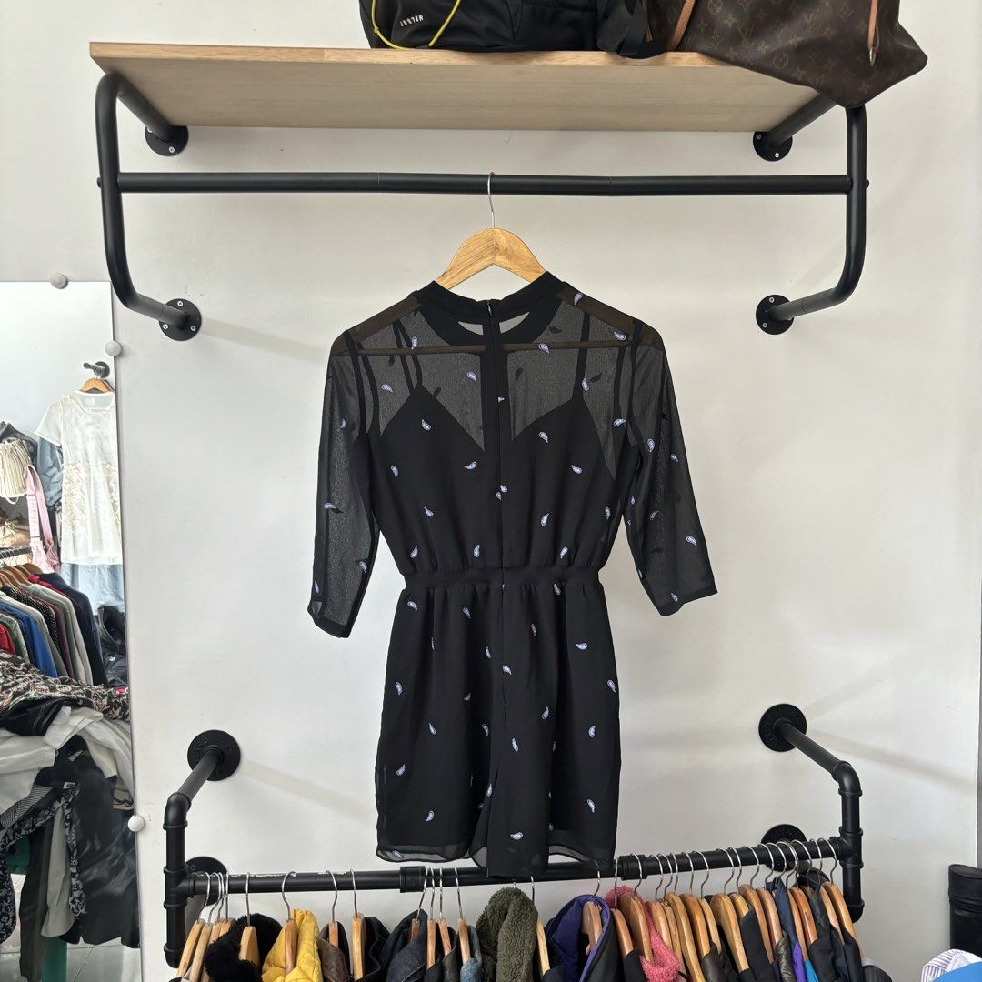 Maje Black Mesh Sheer Long Sleeve Romper Size 34 (Category: Rompers) located in Bambang. Submitted by heats777 (Listing ID 1468820884, Image 3). Description: - Brand: Maje - Size: 34 (with tags attached) - Color: Classic Black - Design: Sheer mesh top with all-over mini pattern and built-in camisole - Details: 3/4 sleeves, elastic waist, and secure back zipper closure - Condition: Brand new, clean, and never worn.