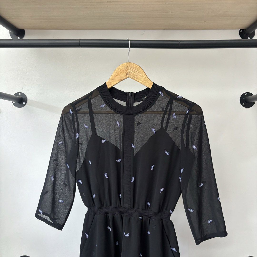 Maje Black Mesh Sheer Long Sleeve Romper Size 34 (Category: Rompers) located in Bambang. Submitted by heats777 (Listing ID 1468820884, Image 1). Description: - Brand: Maje - Size: 34 (with tags attached) - Color: Classic Black - Design: Sheer mesh top with all-over mini pattern and built-in camisole - Details: 3/4 sleeves, elastic waist, and secure back zipper closure - Condition: Brand new, clean, and never worn.