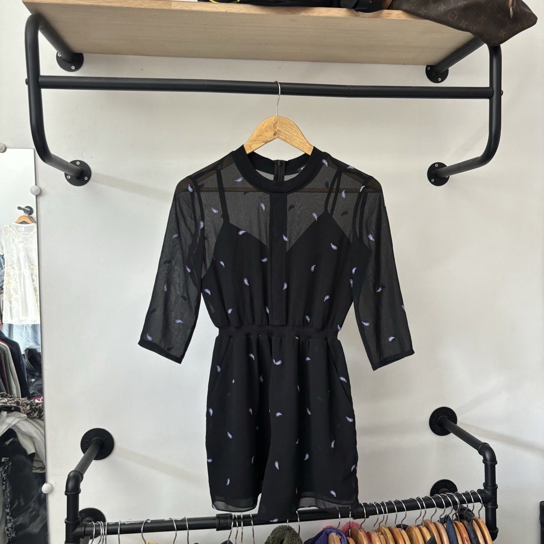Maje Black Mesh Sheer Long Sleeve Romper Size 34 (Category: Rompers) located in Bambang. Submitted by heats777 (Listing ID 1468820884, Image 2). Description: - Brand: Maje - Size: 34 (with tags attached) - Color: Classic Black - Design: Sheer mesh top with all-over mini pattern and built-in camisole - Details: 3/4 sleeves, elastic waist, and secure back zipper closure - Condition: Brand new, clean, and never worn.