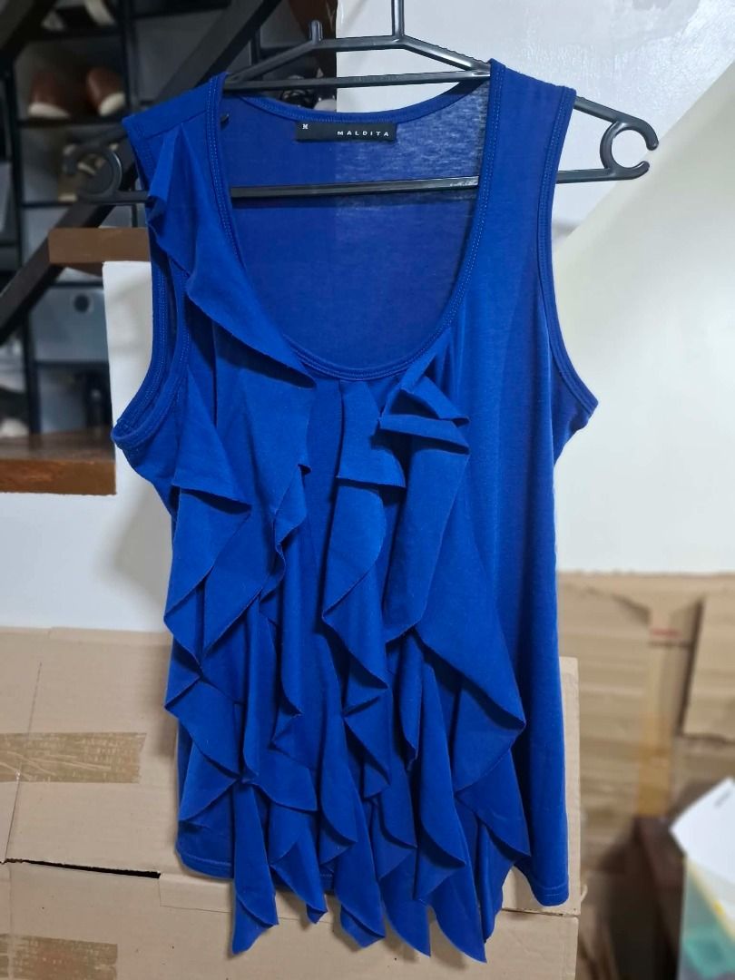 MALDITA Blue Ruffle Sleeveless Top (Category: Sleeveless) located in Pasig City. Submitted by dripcounty (Listing ID 1468837476, Image 1). Description: MALDITA Blue Ruffle Sleeveless Top ₱200 Size: Medium (tagged) Condition: Preloved; please check actual photos Royal blue sleeveless top with scoop neckline and cascading front ruffles. Actual item shown in photos. Delivery fee shouldered by buyer (Lalamove / other courier). Item price excludes del