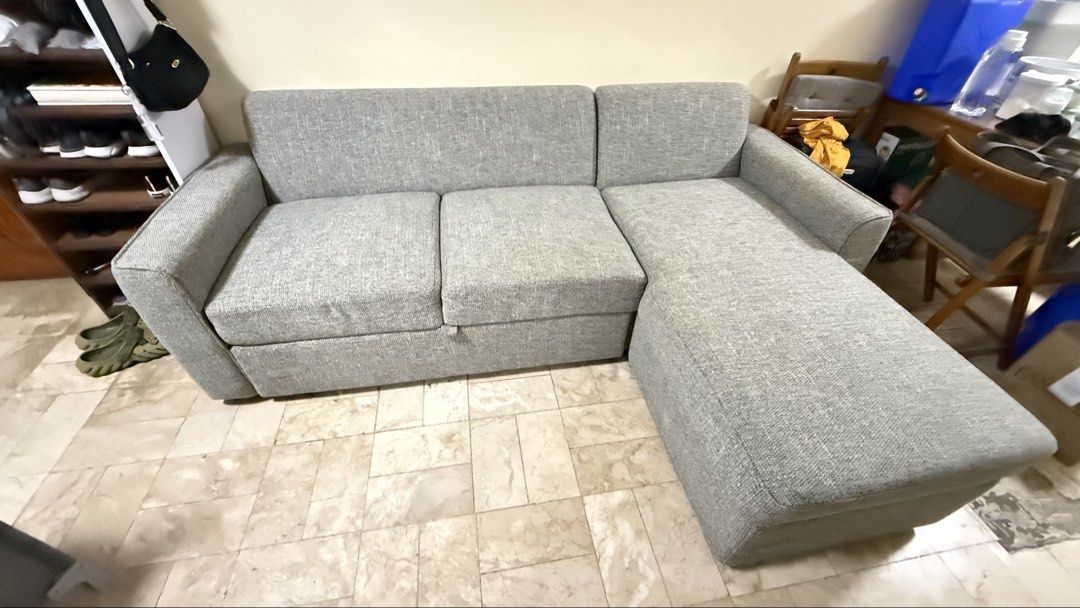 Mandaue Grey L-Shaped Sofa Bed with Storage (Category: Sofas) located in Paranaque City. Submitted by keyzer.soze (Listing ID 1468856322, Image 1). Description: - Colour/Material: Light grey textured fabric - Features: Built-in storage under chaise lounge & pull-out bed mechanism - Condition: Clean cushions and sturdy frame - Ideal for: Living rooms or guest rooms as a space-saving piece - Delivery: Self-collection needed Well maintained and with