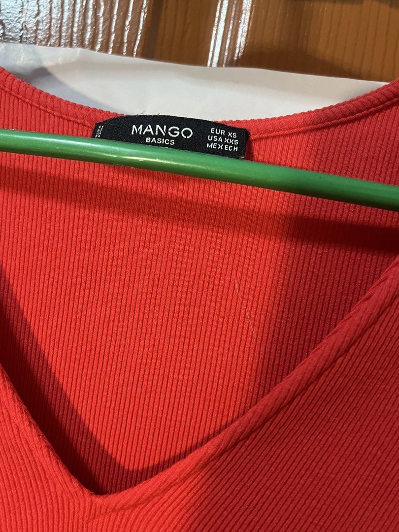 Mango Basics Red V-Neck Ribbed Long Sleeve Top (Category: Longsleeves) located in Marikina City. Submitted by yssacee (Listing ID 1468901317, Image 3). Description: - Brand: Mango Basics - Color: Bright red - Size: EUR XS / USA XXS - Material/Texture: Lightweight ribbed fabric - Neckline: V-neck - Styling: Perfect for layering or everyday wear - Super soft and comfy to wear ! Good quality -rfs: does not fit me anymore - pm for more photos/other q