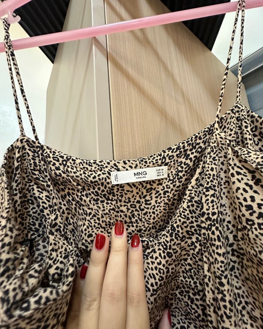 MANGO Casual Leopard Print Spaghetti Strap Dress Size M (Category: Dresses) located in Pasig City. Submitted by p.re.loved (Listing ID 1468858324, Image 3). Description: - Brand: MNG - Size: M - Pattern: Allover leopard / animal print - Design: Spaghetti straps, midi length, easy slip-on style, slit - Fabric: Lightweight, smooth, and clean - Versatility: Great for casual day outs or evening wear.