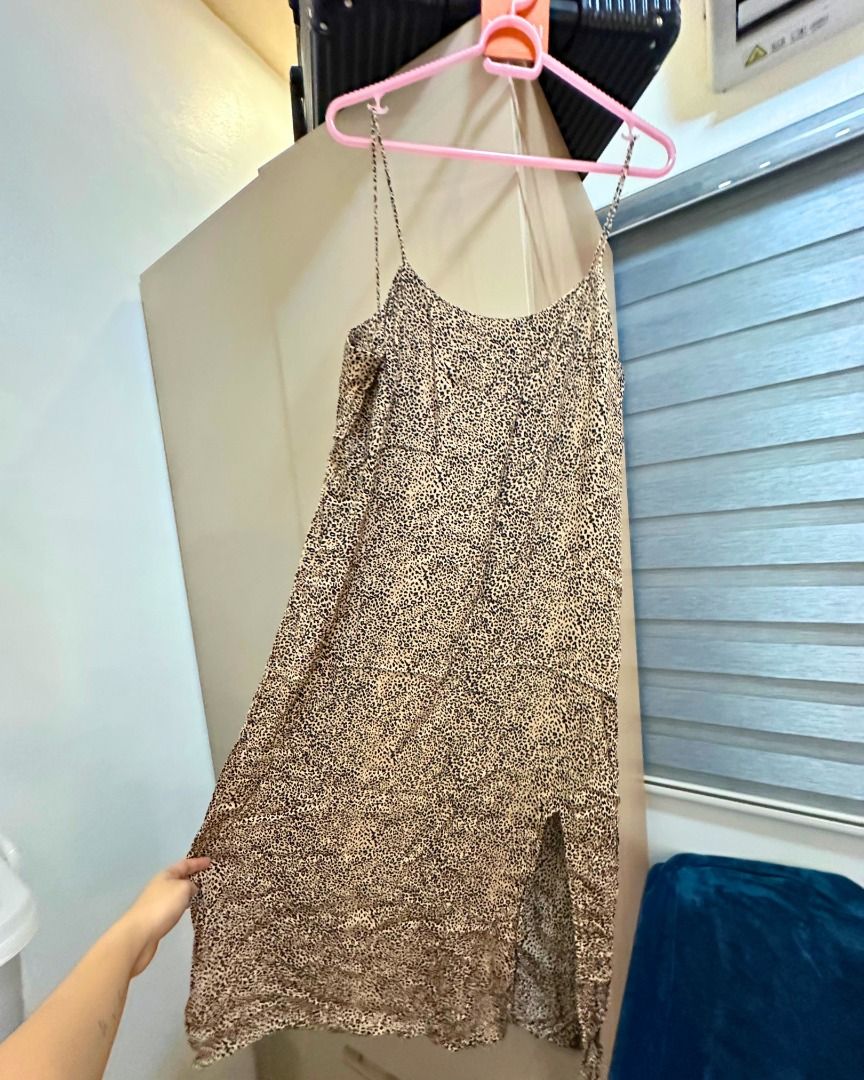 MANGO Casual Leopard Print Spaghetti Strap Dress Size M (Category: Dresses) located in Pasig City. Submitted by p.re.loved (Listing ID 1468858324, Image 2). Description: - Brand: MNG - Size: M - Pattern: Allover leopard / animal print - Design: Spaghetti straps, midi length, easy slip-on style, slit - Fabric: Lightweight, smooth, and clean - Versatility: Great for casual day outs or evening wear.