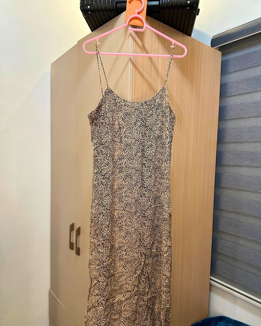 MANGO Casual Leopard Print Spaghetti Strap Dress Size M (Category: Dresses) located in Pasig City. Submitted by p.re.loved (Listing ID 1468858324, Image 1). Description: - Brand: MNG - Size: M - Pattern: Allover leopard / animal print - Design: Spaghetti straps, midi length, easy slip-on style, slit - Fabric: Lightweight, smooth, and clean - Versatility: Great for casual day outs or evening wear.