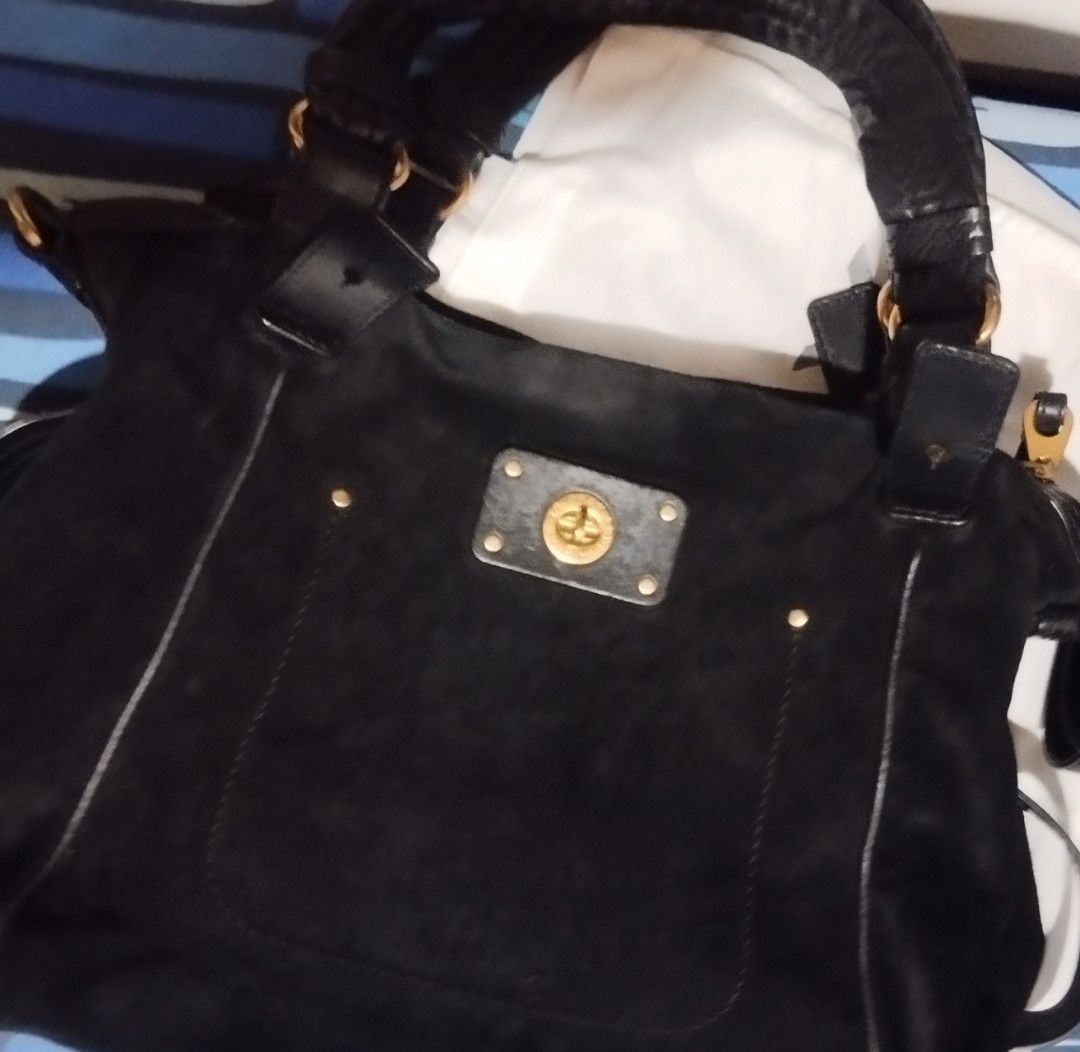 Marc by Marc Jacobs black suede handbag (Category: Cross-body Bags) located in Manila. Submitted by lene48 (Listing ID 1468777218, Image 1). Description: - Brand: Marc by Marc Jacobs - Material: Soft black suede with contrast topstitching - Hardware: Gold-tone throughout, featuring a front pocket turnlock closure - Straps: Double shoulder straps plus an adjustable, detachable leather strap with lobster clasps - Interior: Spacious and roomy for da