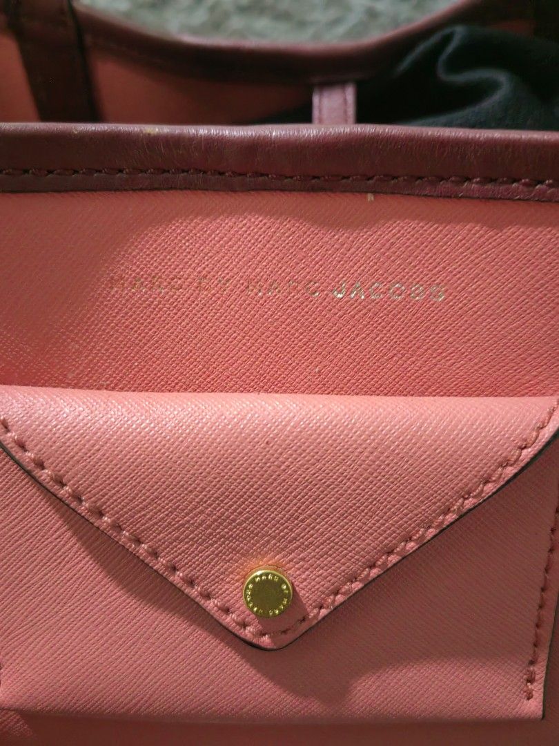 Marc by Marc Jacobs Pink Leather Tote Bag (Category: Tote Bags) located in Las Pinas. Submitted by huslerz (Listing ID 1468818823, Image 3). Description: - Brand: Marc Jacobs - Style: Leather Tote Bag - Color: Pink with dark maroon straps and trim - Hardware: Gold tone details - Inclusions: Matching zip pouch and original dust bag - Features: Small front envelope pocket for easy access - Condition: Well-maintained and ready to use - Meet-ups and 