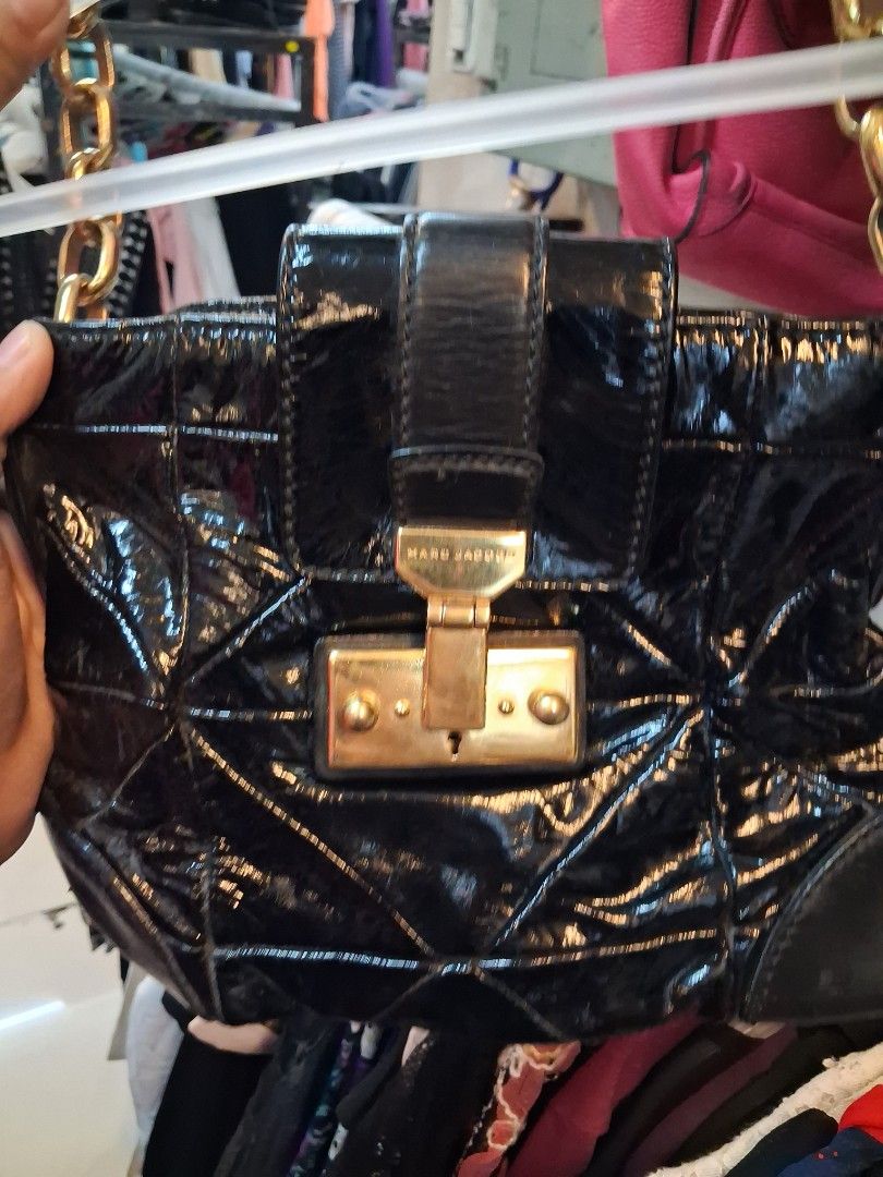 Marc Jacobs Black Patent Leather Bag (Category: Luxury Bags & Wallets) located in Manila. Submitted by zafi_ (Listing ID 1468763134, Image 3). Description: - Brand: Marc Jacobs - Material: Black patent leather with dark leather bottom corner accents - Design: Quilted geometric pattern with gold hardware and front clasp closure - Strap: Chunky gold chain with comfortable leather shoulder section - Condition: Great structural integrity, interior an