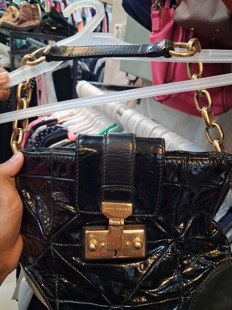 Marc Jacobs Black Patent Leather Bag (Category: Luxury Bags & Wallets) located in Manila. Submitted by zafi_ (Listing ID 1468763134, Image 1). Description: - Brand: Marc Jacobs - Material: Black patent leather with dark leather bottom corner accents - Design: Quilted geometric pattern with gold hardware and front clasp closure - Strap: Chunky gold chain with comfortable leather shoulder section - Condition: Great structural integrity, interior an