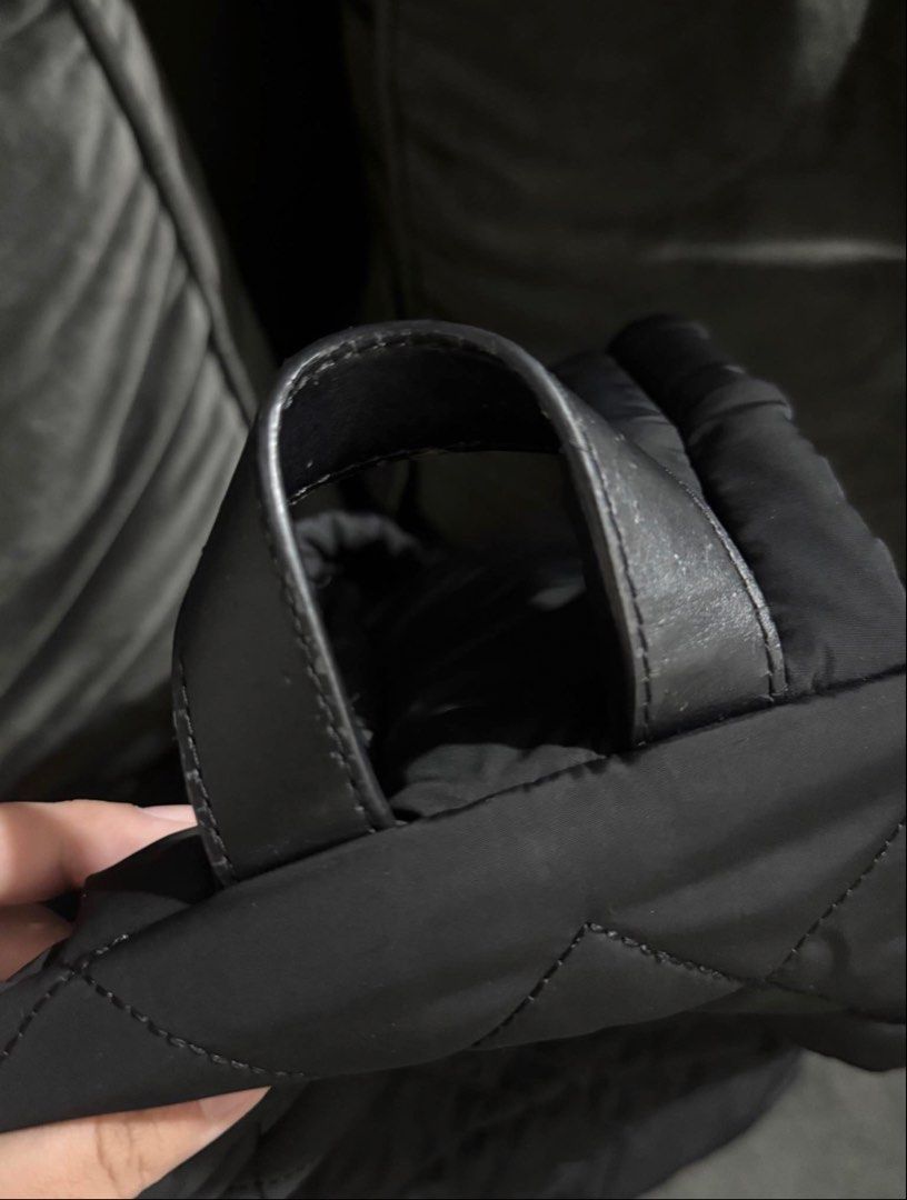 Marc Jacobs Black Quilted Nylon Backpack (Category: Backpacks) located in Mandaluyong City. Submitted by preloved.alyy (Listing ID 1468751330, Image 3). Description: Legit Reason for sale: I need a bigger backpack Minimal issue: - The zipper handle used to be a leather handle, but eventually nabakbak siya kaya pinalitan ko na ng metal. I can send photos ng previous zipper handle niya. - Top handle has minimal leather scratches. Still Negotiable.