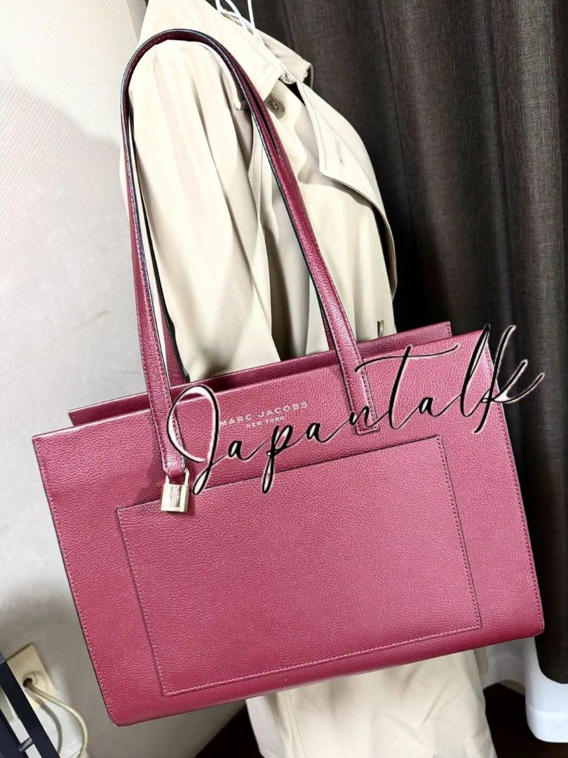 Marc Jacobs Burgundy Tote Bag (Category: Tote Bags) located in Bulacan. Submitted by vintage_purge (Listing ID 1468795276, Image 2). Description: - Authentic Marc Jacobs New York tote bag in rich burgundy leather - Structured design with dual top handles and gold-tone hardware - Front exterior slip pocket with a cute padlock accent - Secure zip-top closure to keep your belongings safe - Spacious interior easily fits a laptop, school books, and da