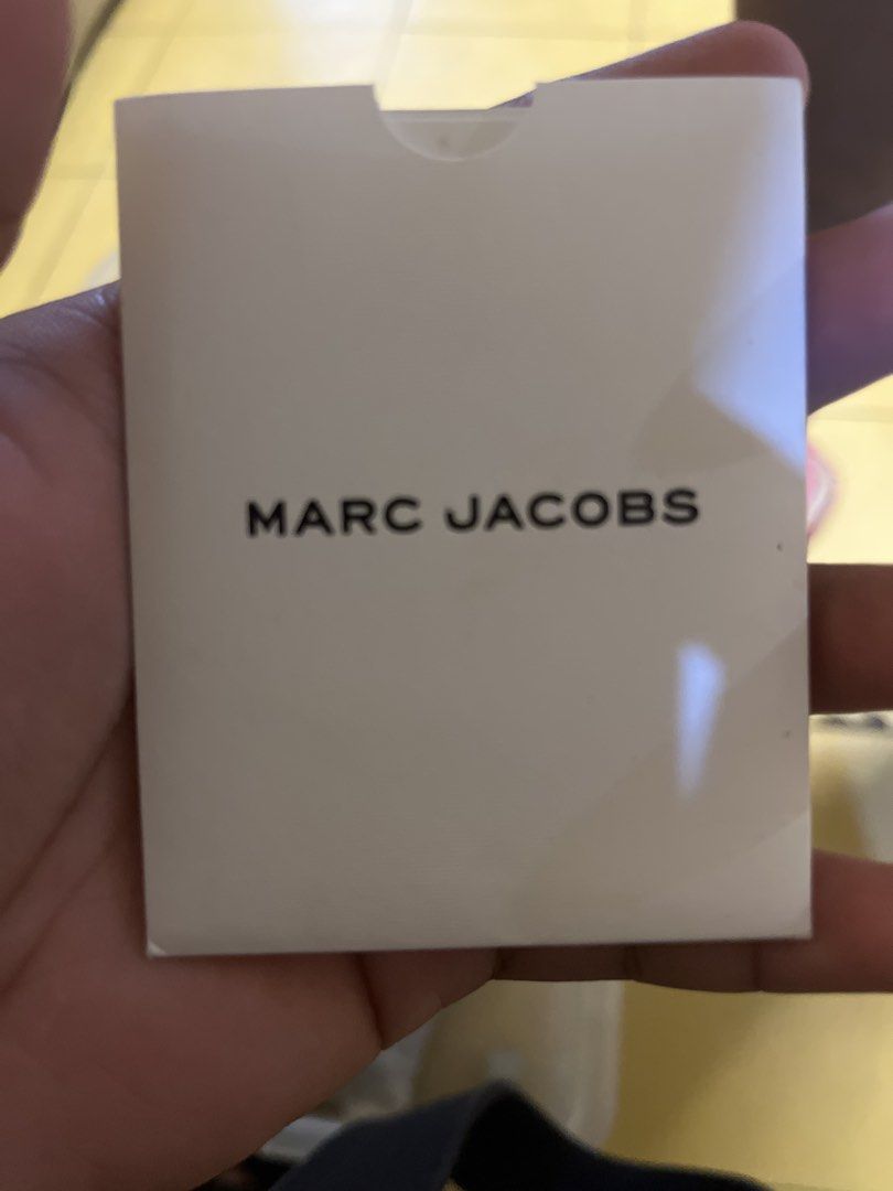 Marc Jacobs New York Canvas Tote Bag (Category: Tote Bags) located in Manila. Submitted by rogerfranklin (Listing ID 1468713466, Image 2). Description: - Brand: Marc Jacobs New York - Color: Black with bold graphic logo print - Material: Durable canvas fabric - Design: Contrasting side stripe detail - Condition: Clean interior, sturdy handles - Usage: Spacious daily carryall for work, school, or casual lakad.