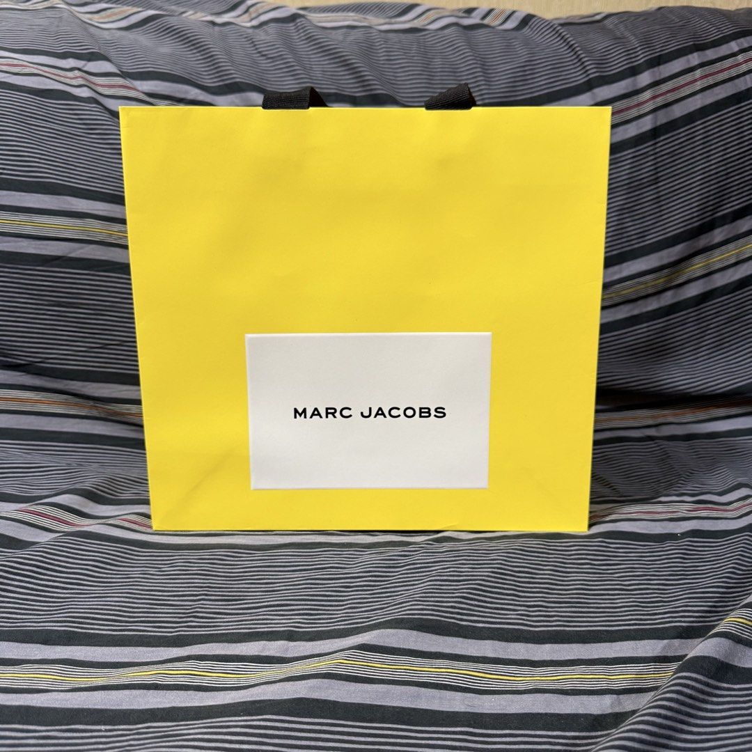 Marc Jacobs Paper Bag (Category: Everything Else Others) located in Quezon City. Submitted by jshoppppp (Listing ID 1468923177, Image 3). Description: Authentic paper bags from Marc Jacobs Size: 9” x 9” Used once during store purchase, no issues P450 each BPI, BDO, Gcash Delivery c/o buyer.