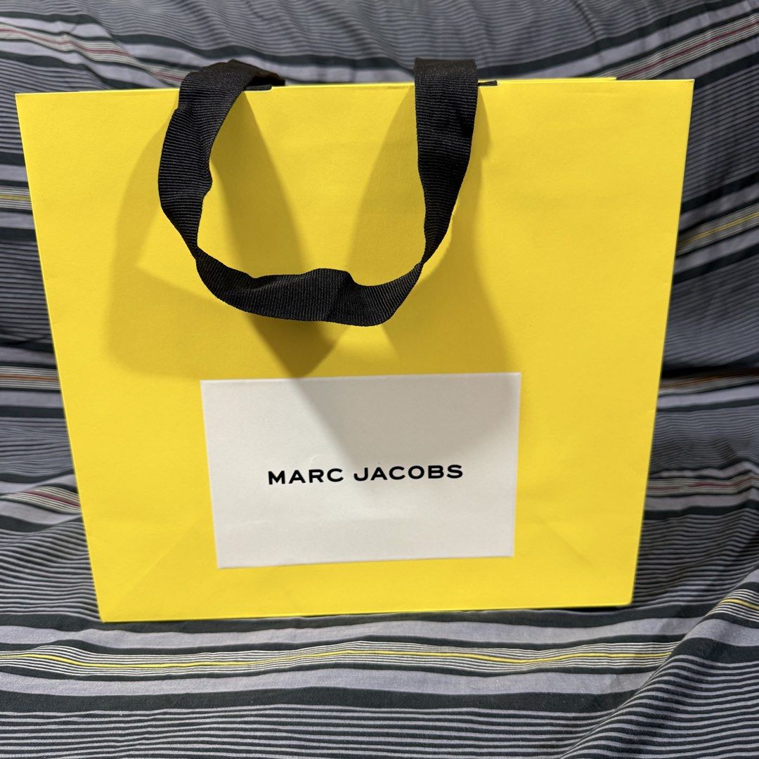 Marc Jacobs Paper Bag (Category: Everything Else Others) located in Quezon City. Submitted by jshoppppp (Listing ID 1468923177, Image 2). Description: Authentic paper bags from Marc Jacobs Size: 9” x 9” Used once during store purchase, no issues P450 each BPI, BDO, Gcash Delivery c/o buyer.