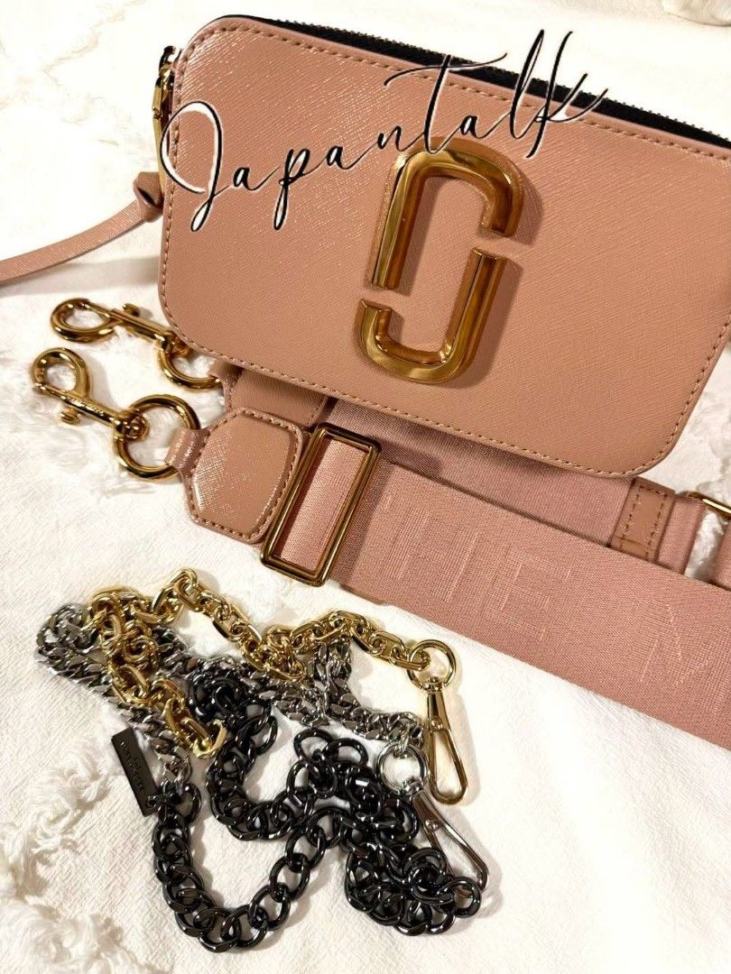 Marc Jacobs Snapshot Camera Bag Pink (Category: Luxury Bags & Wallets) located in Bulacan. Submitted by vintage_purge (Listing ID 1468797541, Image 1). Description: - Brand: Marc Jacobs Snapshot Bag - Color: Dusty Pink with Gold-tone hardware - Material: Durable Saffiano leather - Design: Iconic double-J logo, dual zip compartments, and back slip pocket - Straps included: 1x branded wide fabric strap AND 2x bonus interchangeable chains (gold and 