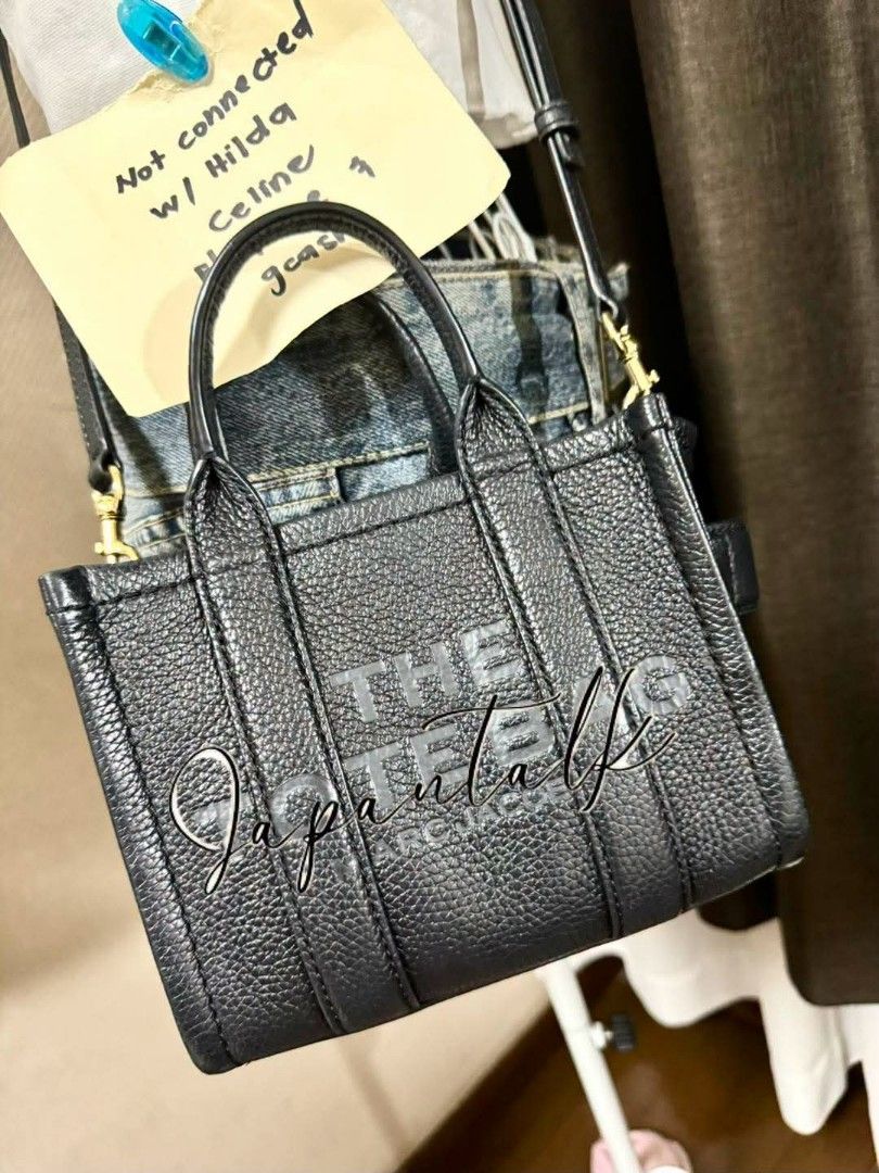 Marc Jacobs The Tote Bag Mini Black Leather (Category: Luxury Bags & Wallets) located in Bulacan. Submitted by vintage_purge (Listing ID 1468793669, Image 2). Description: - Authentic Marc Jacobs Mini Tote Bag - Color: Black - Material: Genuine Leather - Features embossed Marc Jacobs logo - Dual top handles - Detachable and adjustable crossbody strap - Compact size, fits phone, wallet, keys - Versatile for daily use or evening outings - Originall