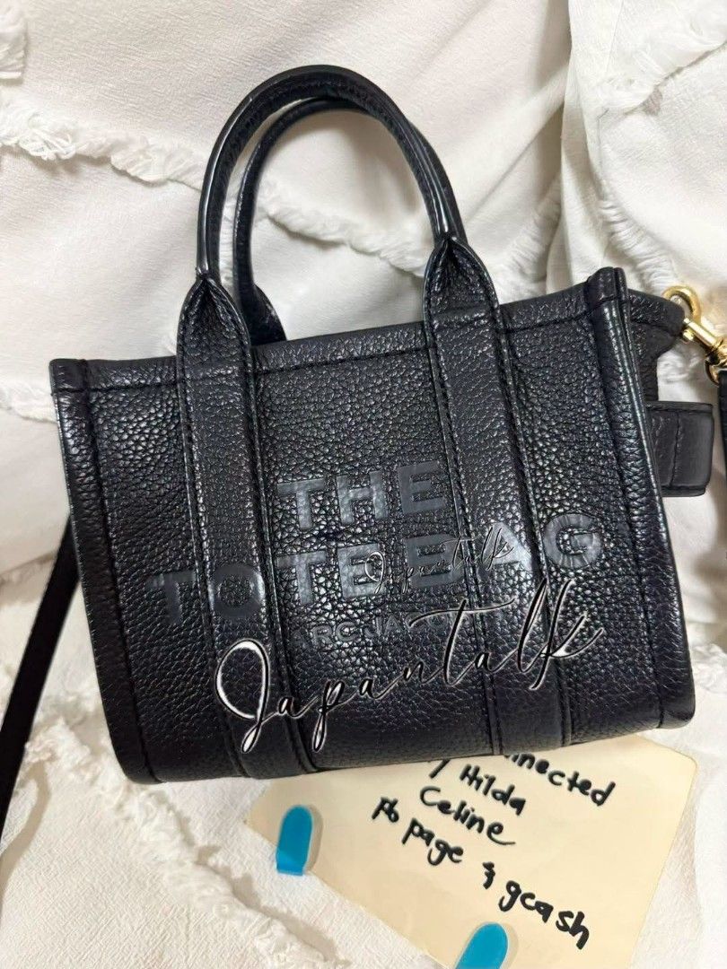 Marc Jacobs The Tote Bag Mini Black Leather (Category: Luxury Bags & Wallets) located in Bulacan. Submitted by vintage_purge (Listing ID 1468793669, Image 1). Description: - Authentic Marc Jacobs Mini Tote Bag - Color: Black - Material: Genuine Leather - Features embossed Marc Jacobs logo - Dual top handles - Detachable and adjustable crossbody strap - Compact size, fits phone, wallet, keys - Versatile for daily use or evening outings - Originall