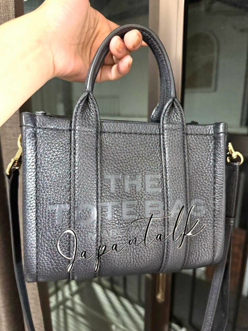 Marc Jacobs The Tote Bag Mini Black Leather (Category: Luxury Bags & Wallets) located in Bulacan. Submitted by vintage_purge (Listing ID 1468793669, Image 3). Description: - Authentic Marc Jacobs Mini Tote Bag - Color: Black - Material: Genuine Leather - Features embossed Marc Jacobs logo - Dual top handles - Detachable and adjustable crossbody strap - Compact size, fits phone, wallet, keys - Versatile for daily use or evening outings - Originall