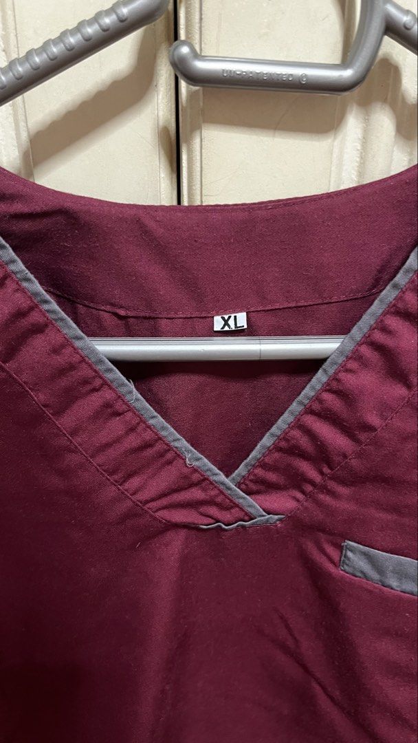 Maroon and Grey Scrub Set Size XL (Category: Sets or Coordinates) located in Manila. Submitted by krisha28_12 (Listing ID 1468766120, Image 1). Description: - Size: XL - Color: Maroon top with grey trim, paired with grey cargo pants - Top Features: V-neck design and convenient chest pocket - Pants Features: Comfortable elastic waistband with drawstring and multiple cargo pockets - Condition: Slightly used matching set with stylish contrasting col