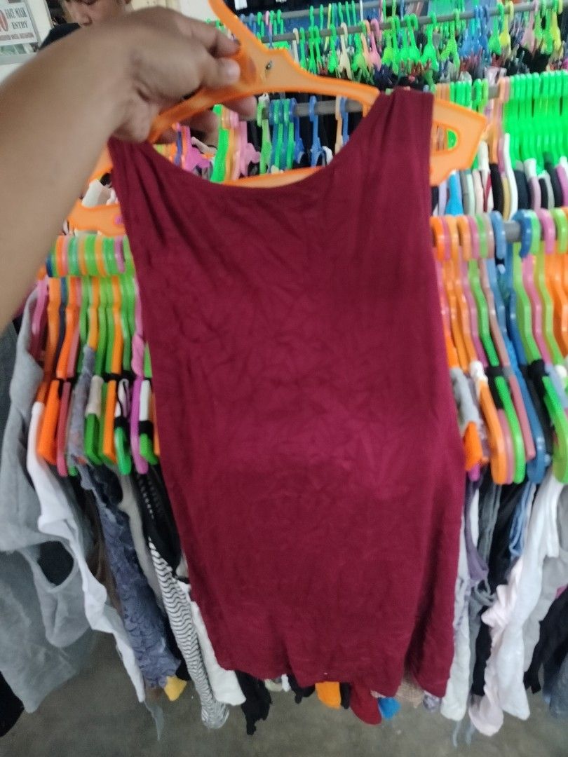 Maroon Tank Top with Rhinestone Collar (Category: Sleeveless) located in Manila. Submitted by virgiliosa38485 (Listing ID 1468718953, Image 3). Description: - Color: Maroon - Style: Sleeveless top with scoop neckline and standard fit - Detail: Bold black rhinestone and silver beaded collar - Material: Soft, stretchable, and very comfortable - Versatility: Perfect for casual wear with jeans/shorts or dressed up for the evening.