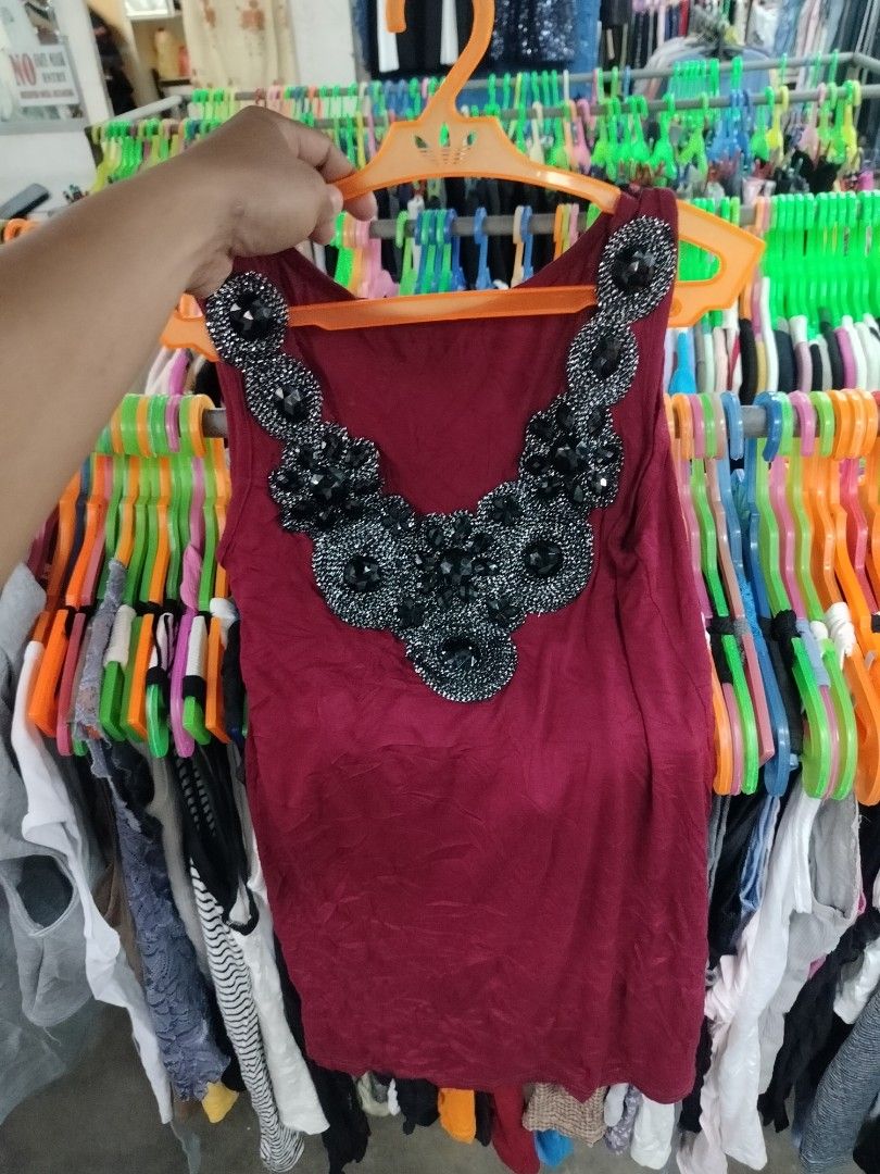 Maroon Tank Top with Rhinestone Collar (Category: Sleeveless) located in Manila. Submitted by virgiliosa38485 (Listing ID 1468718953, Image 1). Description: - Color: Maroon - Style: Sleeveless top with scoop neckline and standard fit - Detail: Bold black rhinestone and silver beaded collar - Material: Soft, stretchable, and very comfortable - Versatility: Perfect for casual wear with jeans/shorts or dressed up for the evening.