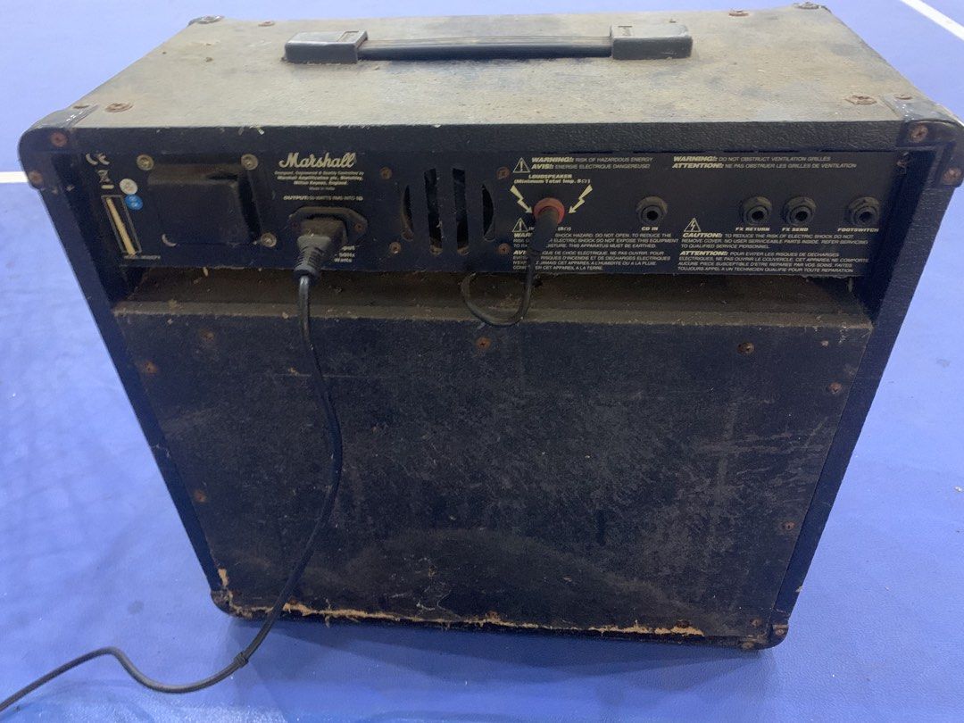 Marshall MG50DFX Guitar Amplifier (Category: Soundbars, Speakers & Amplifiers) located in Cavite. Submitted by cachupoii (Listing ID 1468722271, Image 1). Description: - 50 watts of power with classic Marshall tone - Gold control panel with clean and overdrive channels - Built-in digital FX section, FX loop, CD input, and headphone jack - Power cable attached and ready to use - Condition: Fully functional, with exterior dust and minor wear on bot