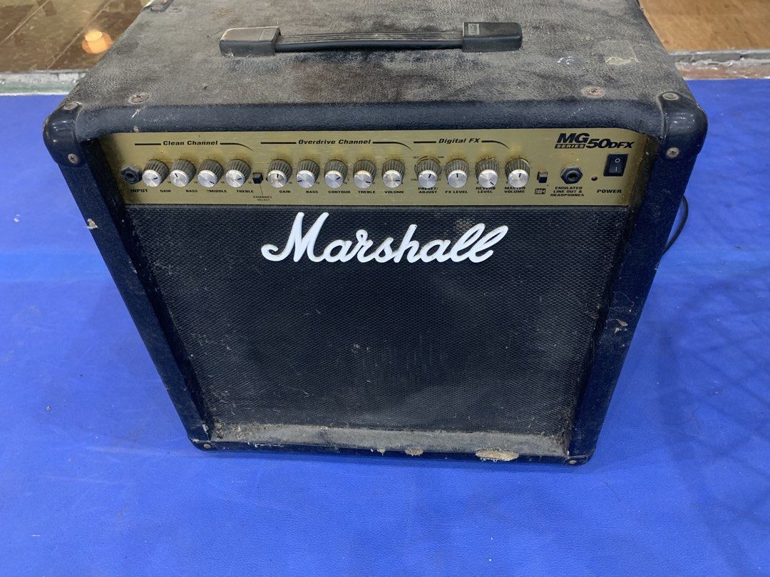 Marshall MG50DFX Guitar Amplifier (Category: Soundbars, Speakers & Amplifiers) located in Cavite. Submitted by cachupoii (Listing ID 1468722271, Image 2). Description: - 50 watts of power with classic Marshall tone - Gold control panel with clean and overdrive channels - Built-in digital FX section, FX loop, CD input, and headphone jack - Power cable attached and ready to use - Condition: Fully functional, with exterior dust and minor wear on bot
