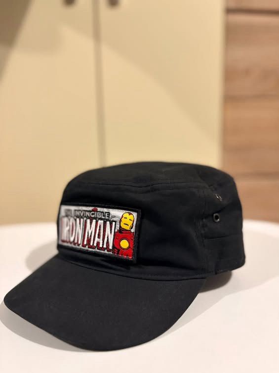 Marvel Comics Iron Man Black Cadet Cap (Category: Vintage Collectibles) located in Cebu City. Submitted by ubecstoned (Listing ID 1468819001, Image 2). Description: - Style: Cadet cap - Color: Black - Material: Cotton - Design: Embroidered Iron Man patch on front with Marvel Comics branding on the back - Interior: Colorful Iron Man comic book print lining - Closure: Adjustable metal buckle strap - Condition: Clean with intact tags - Ideal for: Ma