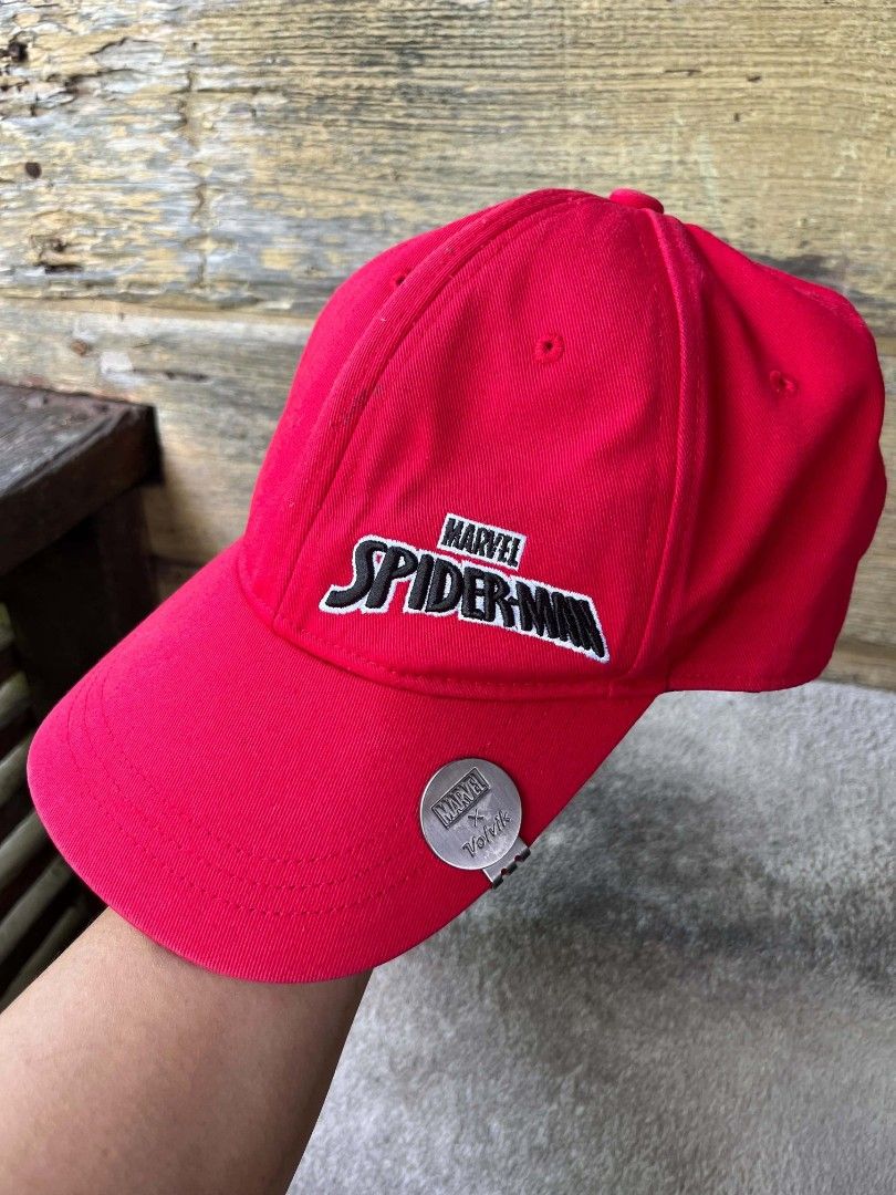 Marvel x Volvik Spider-Man Red Baseball Cap (Category: Caps & Hats) located in Baroy. Submitted by laudecarlfe24 (Listing ID 1468747438, Image 1). Description: - Official Marvel x Volvik collaboration baseball cap in bright red - Features detailed Spider-Man embroidery on the front panel - Includes a convenient metallic magnetic ball marker attached to the brim edge - Standard curved visor design with breathable embroidered eyelets - Clean condit