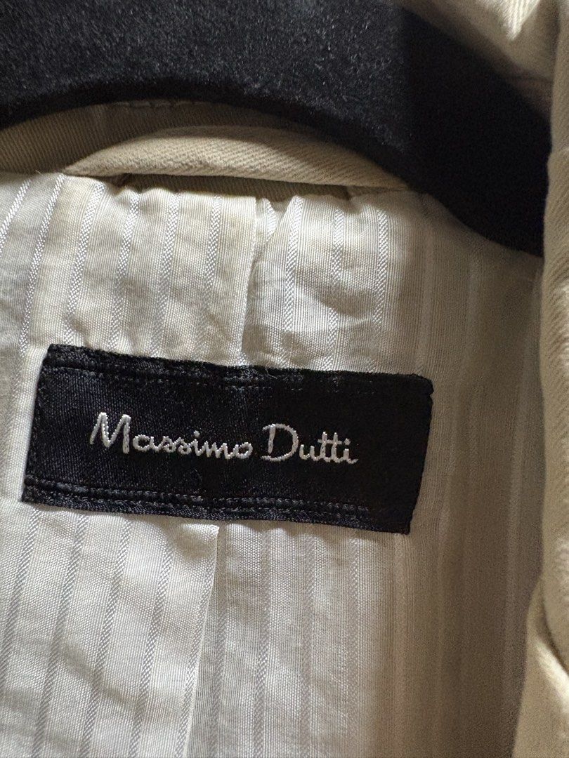 Massimo Dutti Beige Cotton Blend Blazer Jacket (Category: Coats, Jackets and Outerwear) located in Quezon City. Submitted by iris.edit (Listing ID 1468900310, Image 2). Description: - Brand: Massimo Dutti - Style: Classic structured fit beige blazer jacket - Size: 38 - Material: 97% cotton, 3% spandex outer shell; cotton and polyester blend lining - Details: Front button closures, buttoned cuffs, and utility chest pockets - Origin: Made in Portug