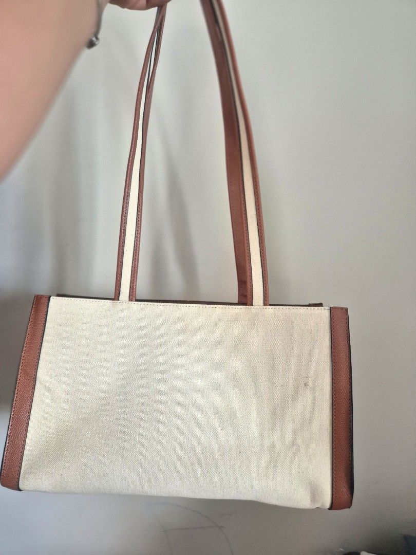 McLanee 977KD shoulder bag (Category: Shoulder Bags) located in Manila. Submitted by mommynurse (Listing ID 1468791065, Image 3). Description: - structured rectangular shape, canvas body with contrasting brown faux/genuine leather trim, front flap pocket with the MCLANEE logo, and long double shoulder/arm straps. - need wash or punas lang - super nice pangattend ng mga event.