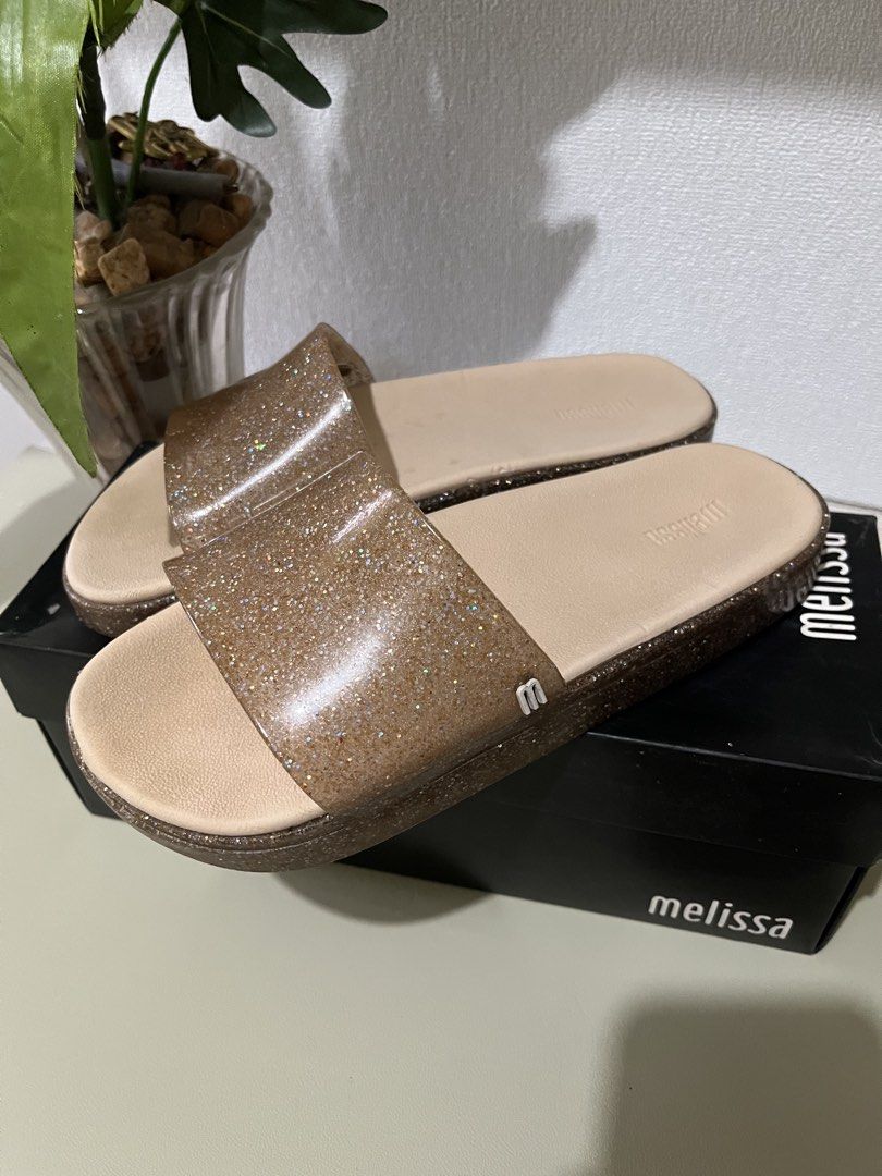 Melissa Beach Slide Next Gen Clear Glitter Beige Slides (Category: Flats & Sandals) located in Quezon City. Submitted by eloveshopping.ph (Listing ID 1468795486, Image 2). Description: - Guaranteed Original Melissa Beach Slide Next Gen - Size: US 6 - Clear Glitter / Pinkish Beige - Super soft, Comfortable slip-on design, sparkly transparent upper strap, and textured soles w/ Original black Melissa box.