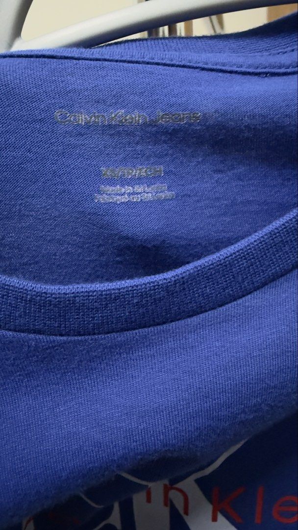 [Men]Calvin Klein T-Shirt (Category: Tshirts & Polo Shirts ) located in Manila. Submitted by rare_closetcleanout (Listing ID 1468803871, Image 2). Description: - Brand: Calvin Klein Jeans - Color: Blue with white and red chest logo - Size: XS - Material: Comfortable, breathable cotton - Design: Crew neck with tagless printed collar - Condition: Great shape, well-maintained and ready to wear - Style: Versatile and easy to match with daily casual o
