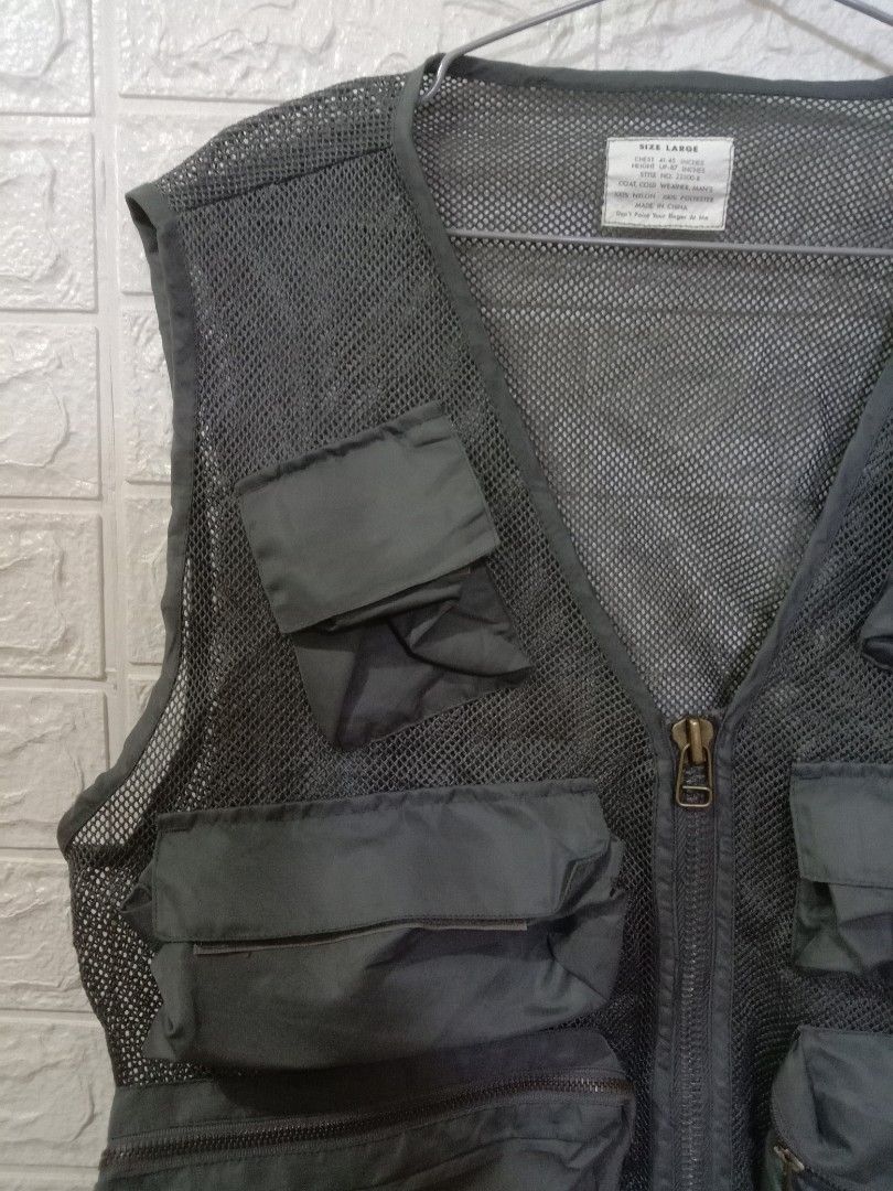 Mens Utility Mesh Vest Multiple Pockets Size Large (Category: Vests) located in Quezon City. Submitted by coolture_thriftph (Listing ID 1468789549, Image 2). Description: - Color & Material: Dark grey breathable mesh fabric - Size: Large (fits chest 41-45 inches) - Style Number: 22500-R - Pockets: Multiple front cargo pockets with secure flap and zipper closures - Closure: Full front zipper with a durable metal pull - Versatile Use: Lightweight l