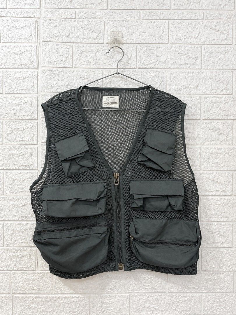 Mens Utility Mesh Vest Multiple Pockets Size Large (Category: Vests) located in Quezon City. Submitted by coolture_thriftph (Listing ID 1468789549, Image 1). Description: - Color & Material: Dark grey breathable mesh fabric - Size: Large (fits chest 41-45 inches) - Style Number: 22500-R - Pockets: Multiple front cargo pockets with secure flap and zipper closures - Closure: Full front zipper with a durable metal pull - Versatile Use: Lightweight l