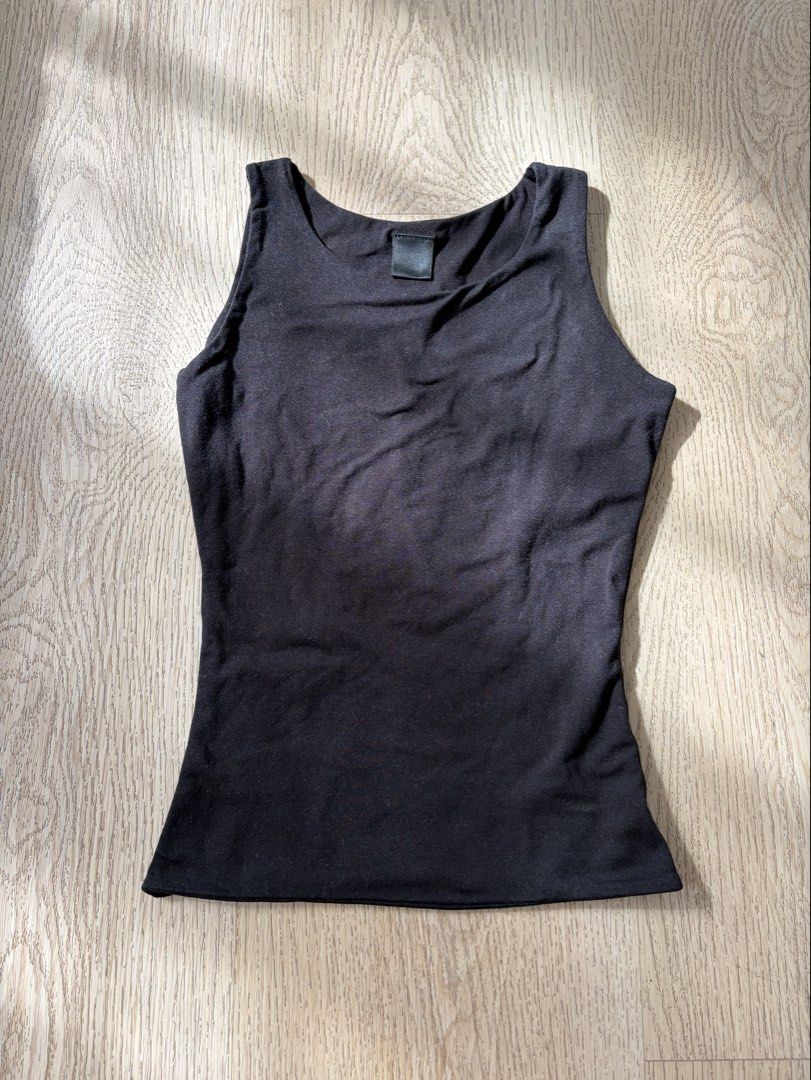 Mera Jacinta Tank Top (Category: Sleeveless) located in Makati City. Submitted by sbllia (Listing ID 1468771009, Image 1). Description: - Color: Solid black - Cotton spandex with stretch - Classic scoop neck / halter neck - Slim-fitting.