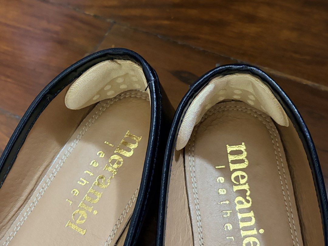 Meraniel Leather Tabi Flats (Category: Flats & Sandals) located in Quezon City. Submitted by fellceas (Listing ID 1468758824, Image 2). Description: - Brand: Meraniel - Color: Black with tan inner sole and gold foil logo - Style: Trendy split-toe tabi design, slip-on - Material: Smooth leather upper - Extras: Heel grips already attached for extra comfort, includes original cardboard shoebox - Pre-ordered, no bow. - Worn only once to fit—too big f